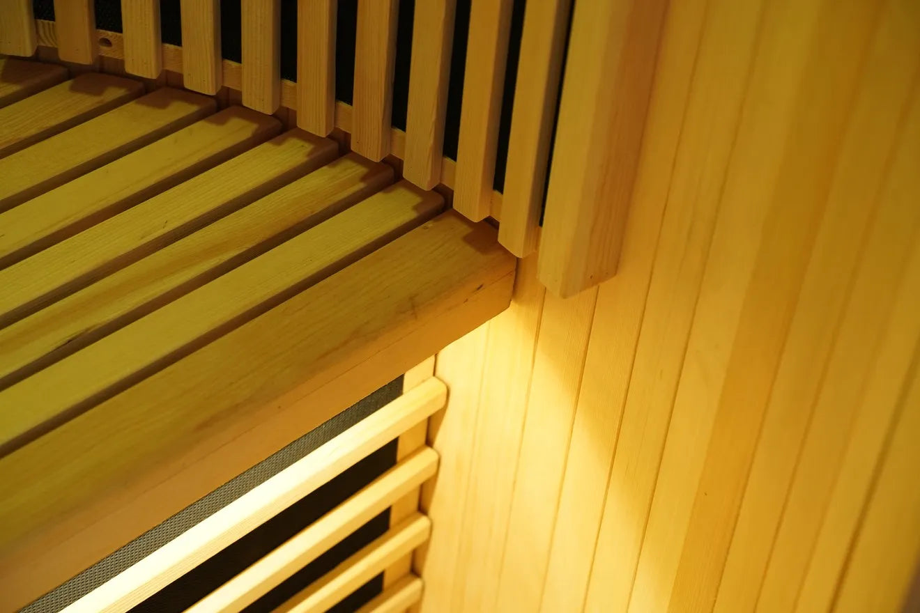 Hemlock wood corner and bench finish inside the R Sauna Circle infrared sauna