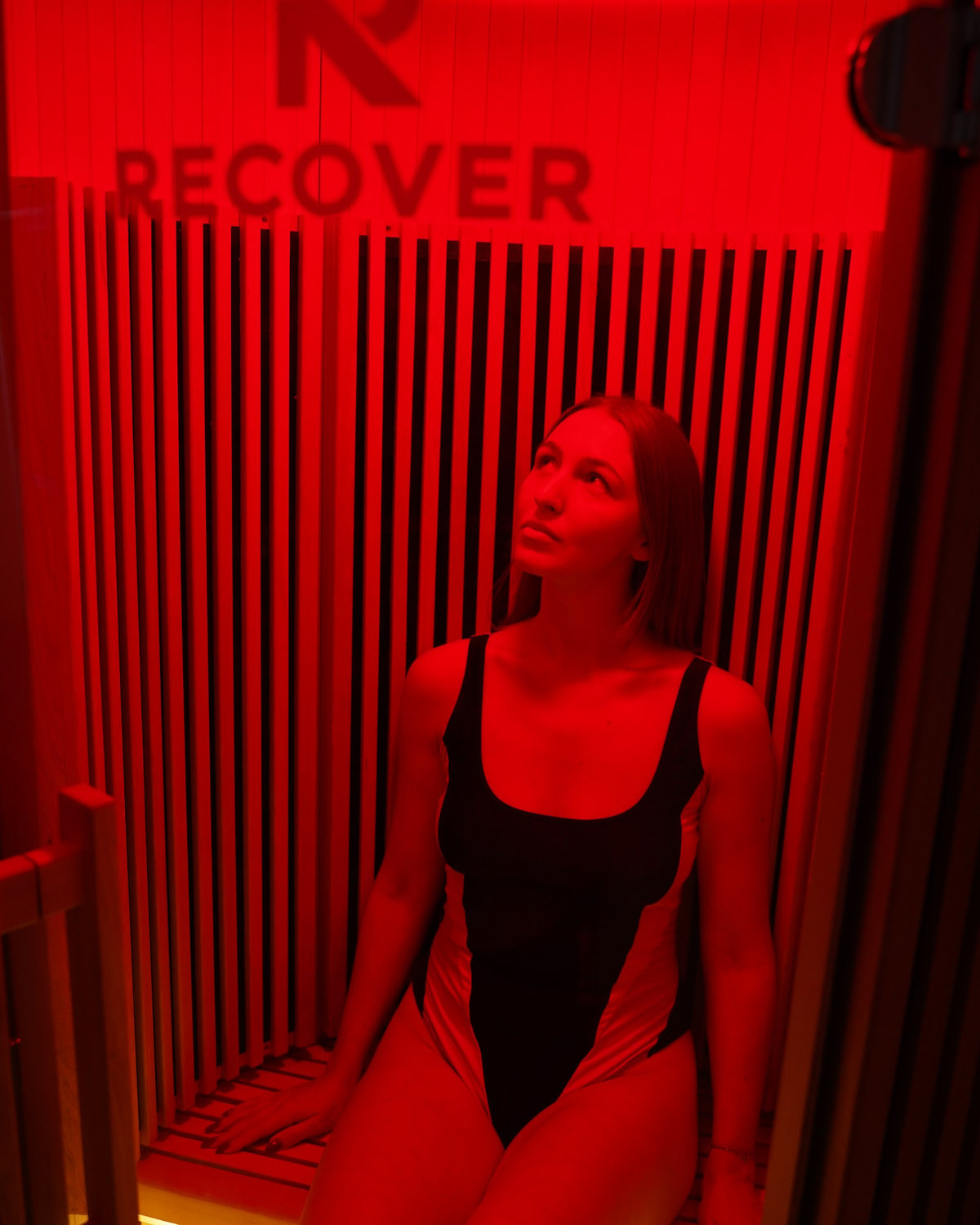 Relaxing under red light inside the R Sauna Circle