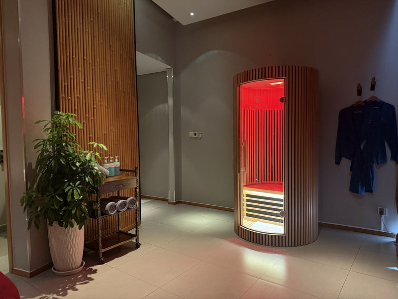 R Sauna Circle in red light in a Novotel Danang spa suite