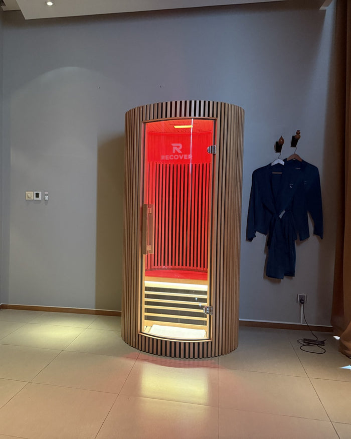 R Sauna Circle in red light in a Novotel Danang spa suite