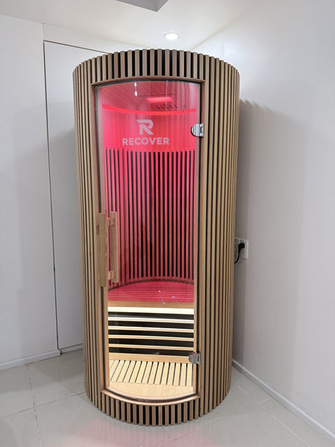 R Sauna Circle in red light in the corner of a room